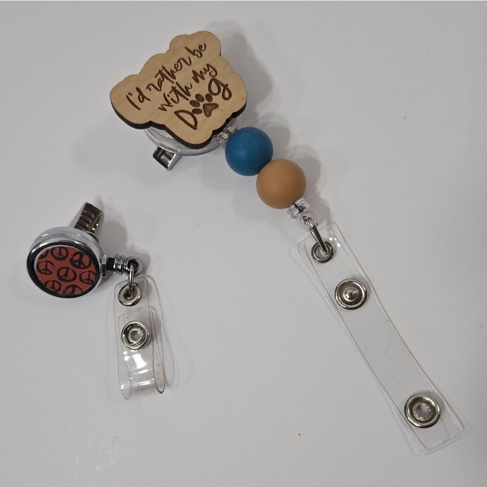 "Id rather be home with by dog" and peace sign badge reels